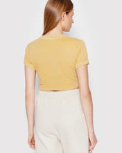 Load image into Gallery viewer, Reebok Natural Dye Fitted Crop T-Shirt in Pastel Gold